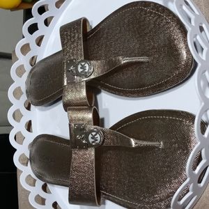 Authentic Michael Kors gold thong sandals